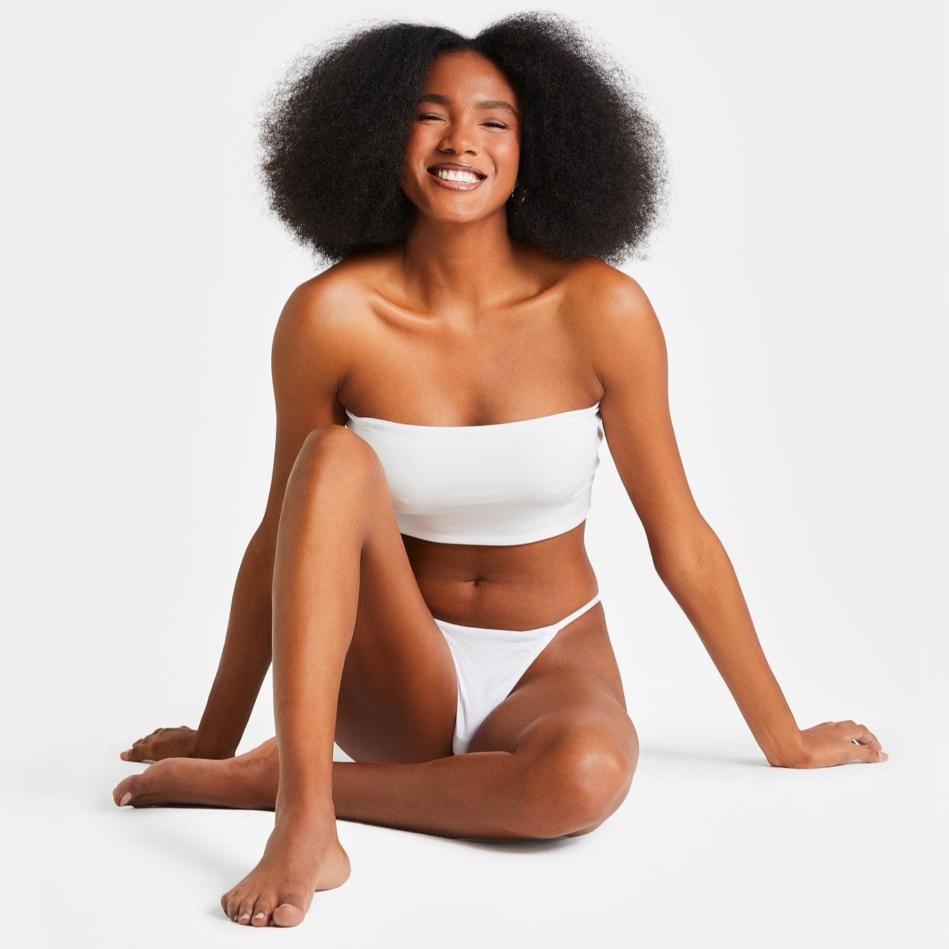 Woman modeling String Nix white seamless thong underwear and bandeau top
